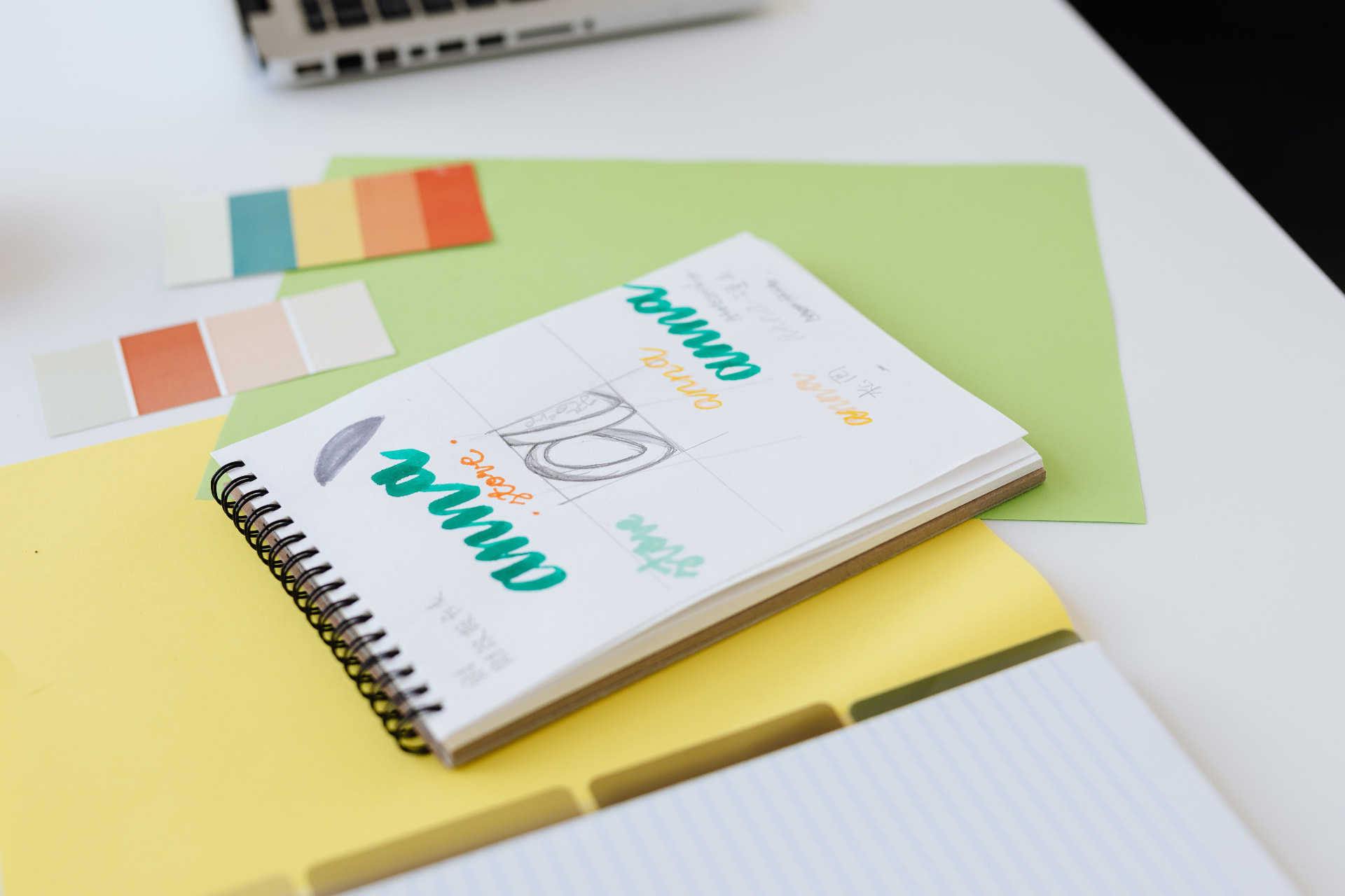 Assortment of branded apparel, drinkware, notebooks, pens, and print materials